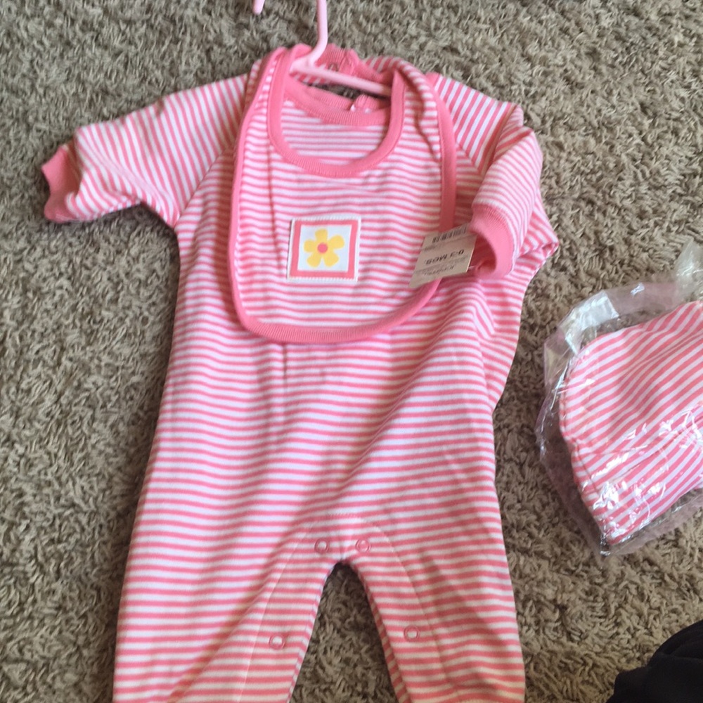 Pink and white striped onesie and flower bib